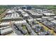 Aerial view of a townhome community near commercial buildings and shopping centers at 204 N Esplanade, Alpharetta, GA 30009