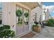 Charming entrance with double doors, stone patio and well-manicured landscaping at 204 N Esplanade, Alpharetta, GA 30009