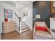 Charming entryway featuring a brick accent wall, wooden floors, and staircase at 204 N Esplanade, Alpharetta, GA 30009