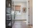 Hallway with abundant sunlight, offering a bright and welcoming area with storage at 204 N Esplanade, Alpharetta, GA 30009