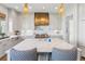Modern kitchen with a large island, marble countertops, custom hood, and stainless steel appliances at 204 N Esplanade, Alpharetta, GA 30009
