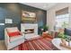 Inviting living room featuring a fireplace, brick accent wall, and ample natural light at 204 N Esplanade, Alpharetta, GA 30009