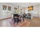 Open-concept with dining area and kitchen featuring hardwood floors and lots of natural light at 204 N Esplanade, Alpharetta, GA 30009