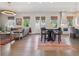 Spacious living area with hardwood floors, dining area, and access to patio at 204 N Esplanade, Alpharetta, GA 30009