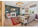 Cozy living room featuring a fireplace, exposed brick accent wall, and comfortable seating arrangement at 204 N Esplanade, Alpharetta, GA 30009