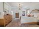 Spacious main bedroom featuring hardwood floors and a neutral palette at 204 N Esplanade, Alpharetta, GA 30009