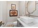 Chic powder room featuring a stylish sink, modern fixtures, and elegant decorative accents at 204 N Esplanade, Alpharetta, GA 30009