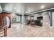 Finished basement features a stone accent wall and a entertainment area at 317 Water Oak Ln, Canton, GA 30114
