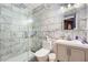 Updated bathroom features a tub and shower with decorative tile surround and modern fixtures at 317 Water Oak Ln, Canton, GA 30114