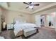 Comfortable bedroom with trey ceiling, soft carpet, and doorway to an attached room at 317 Water Oak Ln, Canton, GA 30114