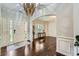 Spacious foyer with dark wood floors, a decorative chandelier, and an arched entryway at 317 Water Oak Ln, Canton, GA 30114