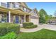 Charming home exterior featuring stone accents, a covered porch, and a well-maintained front lawn at 317 Water Oak Ln, Canton, GA 30114