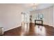 Inviting living room with hardwood floors, chandelier, and sun-lit windows at 317 Water Oak Ln, Canton, GA 30114
