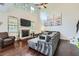 Comfortable living room with dark wood floors, high ceilings, and a stone fireplace at 317 Water Oak Ln, Canton, GA 30114