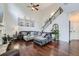Spacious living room with a high ceiling, dark wood floors, and a comfortable gray sectional at 317 Water Oak Ln, Canton, GA 30114