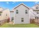 A gray two-story home with a well-maintained lawn and a cozy patio at 3200 Baylor Cir, Mcdonough, GA 30253