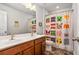 Bathroom features a double vanity and Minecraft-themed shower curtain at 3200 Baylor Cir, Mcdonough, GA 30253