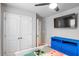 Bedroom has a TV, closet, colorful dresser, and Minecraft bedspread at 3200 Baylor Cir, Mcdonough, GA 30253
