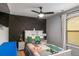 Stylish bedroom with an accent wall, fun decor, and bright natural light at 3200 Baylor Cir, Mcdonough, GA 30253