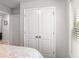 A bedroom has closet space and a window with light-filtering blinds at 3200 Baylor Cir, Mcdonough, GA 30253