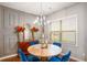 Tasteful dining room features modern chandelier, natural light, and stylish decor at 3200 Baylor Cir, Mcdonough, GA 30253
