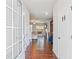 Bright entryway features hardwood floors, an open view of the living room, and a coat closet at 3200 Baylor Cir, Mcdonough, GA 30253