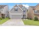 Charming two-story home boasts a well-manicured lawn and an attached two-car garage at 3200 Baylor Cir, Mcdonough, GA 30253