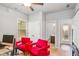 Bright office space with two red armchairs, neutral walls, and ceiling fan at 3200 Baylor Cir, Mcdonough, GA 30253