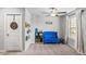 Bright playroom with plush blue seating, decorative touches, and large window with ample natural light at 3200 Baylor Cir, Mcdonough, GA 30253