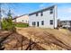 Expansive backyard showcasing a gentle slope, complemented by a stone drainage feature and ample space at 4225 Hopewell Manor Dr, Cumming, GA 30028