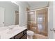 Modern bathroom with a tiled shower, vanity sink, and elegant finishes at 4225 Hopewell Manor Dr, Cumming, GA 30028