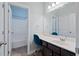Bathroom vanity with large mirror and adjacent shower-tub combo at 4225 Hopewell Manor Dr, Cumming, GA 30028