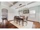 Charming dining room with an archway, decorative walls and a unique chandelier at 4225 Hopewell Manor Dr, Cumming, GA 30028