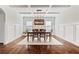 Bright dining room featuring hardwood floors, stylish lighting, and coffered ceiling at 4225 Hopewell Manor Dr, Cumming, GA 30028
