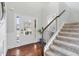 Bright foyer with hardwood floors, staircase, and ample natural light at 4225 Hopewell Manor Dr, Cumming, GA 30028