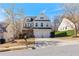 Charming two-story home with a well-manicured lawn, a two-car garage and a blend of brick and siding at 4225 Hopewell Manor Dr, Cumming, GA 30028