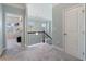 Upstairs hallway with neutral carpet that leads to an office at 4225 Hopewell Manor Dr, Cumming, GA 30028