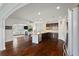 Open-concept kitchen with large island, stainless appliances, and seamless flow into the living area, perfect for entertaining at 4225 Hopewell Manor Dr, Cumming, GA 30028