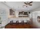 A kitchen features a large center island with seating and a view into the adjacent dining area at 4225 Hopewell Manor Dr, Cumming, GA 30028
