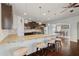 Spacious kitchen showcasing a large island with granite countertop, pendant lighting, and barstool seating at 4225 Hopewell Manor Dr, Cumming, GA 30028