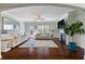 Bright open living room with hardwood floors, comfortable seating, and backyard access at 4225 Hopewell Manor Dr, Cumming, GA 30028