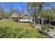 Charming home exterior with a spacious backyard and a detached garage, offering ample outdoor space at 2621 White Oak Dr, Decatur, GA 30032