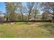 Expansive backyard with mature trees and a fenced perimeter, offering privacy and space at 2621 White Oak Dr, Decatur, GA 30032