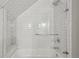 Bathroom featuring subway tile bath and shower with glass door at 2621 White Oak Dr, Decatur, GA 30032