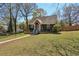 Inviting home exterior with lush green lawn and mature trees on a sunny day at 2621 White Oak Dr, Decatur, GA 30032