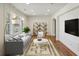 Bright living room featuring stylish decor, large windows, and hardwood floors at 2621 White Oak Dr, Decatur, GA 30032