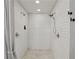 Modern shower with white subway tile, dual shower heads and neutral accents at 2621 White Oak Dr, Decatur, GA 30032