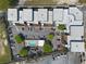 Aerial view from above of community with pool, parking lot, and building rooftops at 89 Mangum Sw St # 119, Atlanta, GA 30313