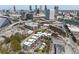 Aerial view of community showing the Atlanta skyline, pool, new construction, and local streets at 89 Mangum Sw St # 119, Atlanta, GA 30313