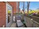 Cozy balcony featuring flower boxes, a comfortable chair, and views of the neighborhood at 89 Mangum Sw St # 119, Atlanta, GA 30313